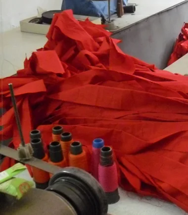 Red wrap strips and thread arranged for material staging