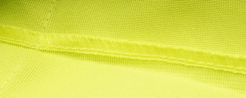 High-visibility knit folded seam and parallel stitch lines for construction review